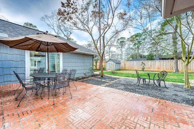 view of patio / terrace featuring a shed