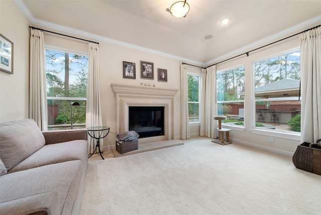 living room featuring ornamental molding, plenty of natural light, and carpet floors