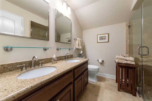 bathroom with vaulted ceiling, toilet, an enclosed shower, and vanity