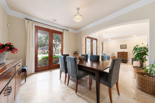 dining area featuring crown molding and french doors