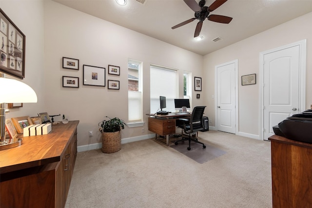 office area with light colored carpet and ceiling fan