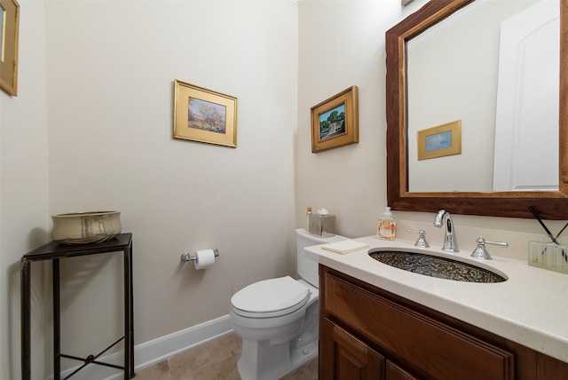 bathroom featuring vanity, tile patterned flooring, and toilet