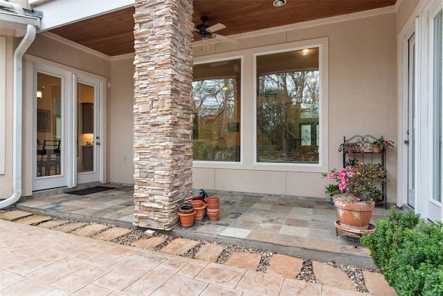 property entrance featuring a patio and ceiling fan