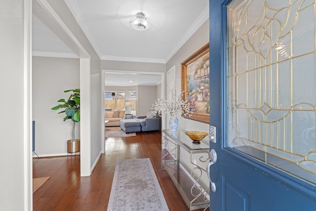 entryway featuring ornamental molding and dark hardwood / wood-style floors