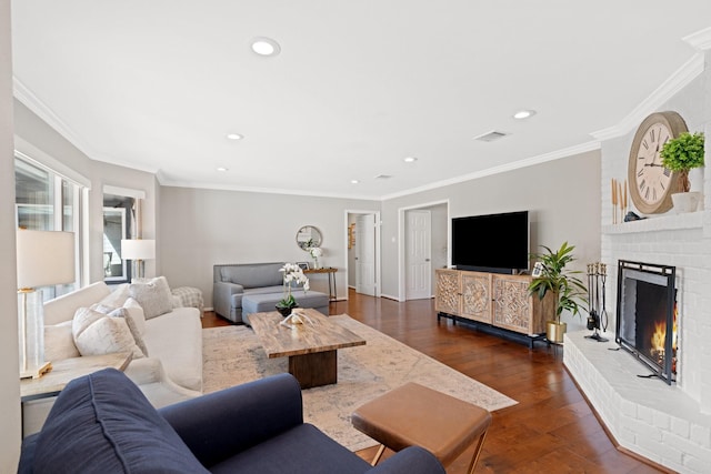 living room featuring dark wood-type flooring, crown molding, and a brick fireplace