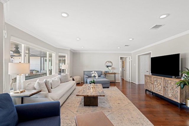 living room featuring ornamental molding and dark hardwood / wood-style floors