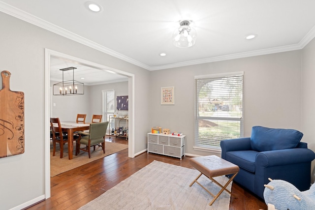 living area featuring ornamental molding, plenty of natural light, and dark wood-type flooring