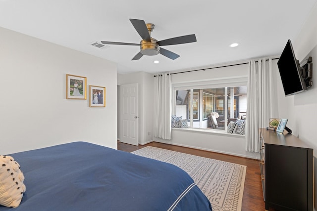 bedroom featuring ceiling fan and dark hardwood / wood-style floors