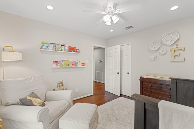 interior space featuring dark wood-type flooring and ceiling fan