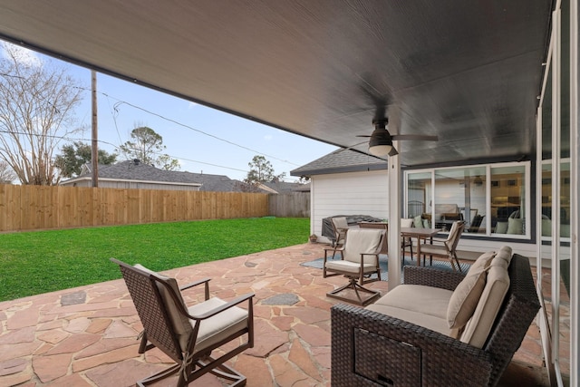 view of patio featuring ceiling fan