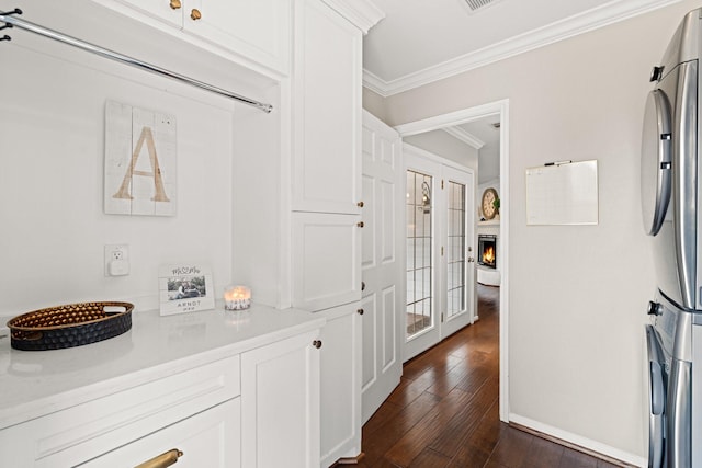 corridor featuring crown molding and dark hardwood / wood-style floors