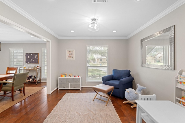 living area featuring crown molding and dark hardwood / wood-style flooring