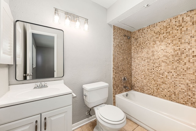 full bathroom with vanity, tiled shower / bath combo, tile patterned floors, and toilet