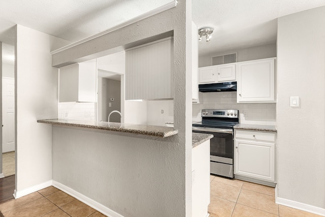 kitchen featuring electric stove, white cabinetry, kitchen peninsula, and light tile patterned flooring