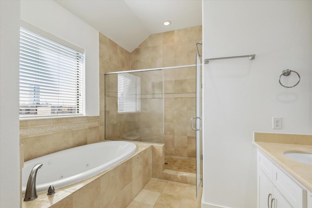 full bathroom with a stall shower, a tub with jets, tile patterned floors, vaulted ceiling, and vanity