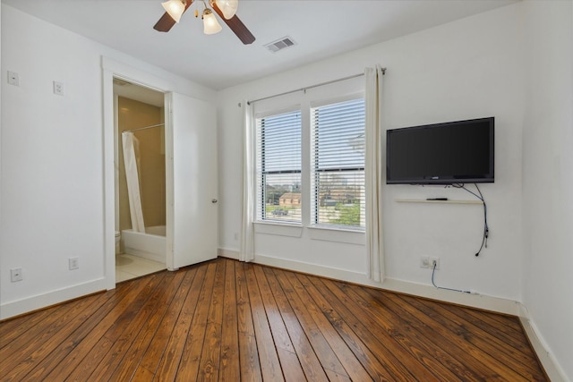 1819 Dart St, Houston, TX 77007 - unfurnished bedroom with wood-type flooring, baseboards, a ceiling fan, and ensuite bathroom