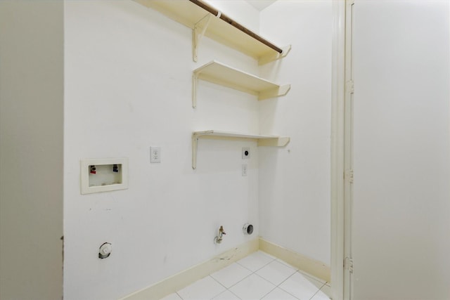 clothes washing area featuring laundry area, gas dryer hookup, hookup for a washing machine, electric dryer hookup, and light tile patterned flooring