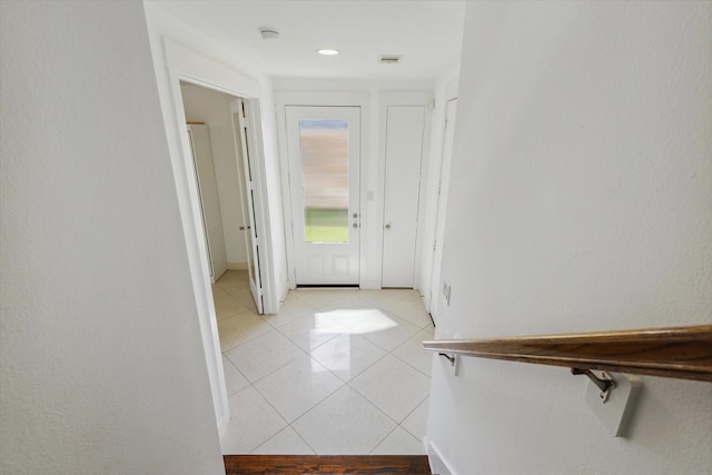 entrance foyer featuring light tile patterned floors and visible vents