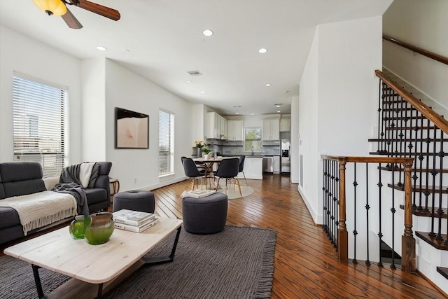 1819 Dart St, Houston, TX 77007 - living area with dark wood-style flooring, recessed lighting, ceiling fan, and stairway