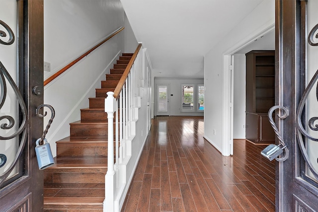 foyer entrance with dark wood-type flooring