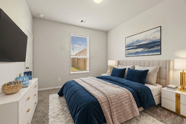 bedroom featuring light colored carpet