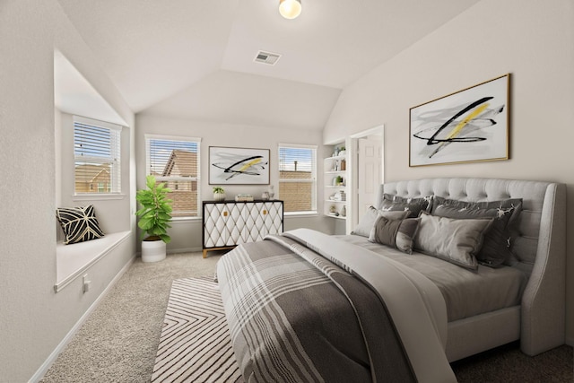 bedroom featuring vaulted ceiling and carpet flooring