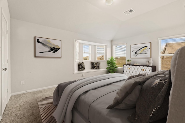 bedroom with vaulted ceiling and carpet flooring