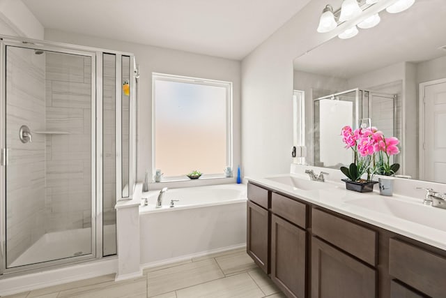 bathroom featuring vanity and plus walk in shower