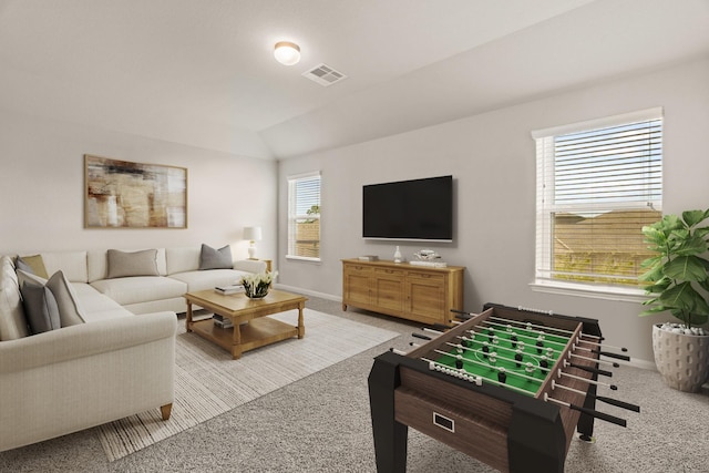 living room featuring lofted ceiling and light carpet