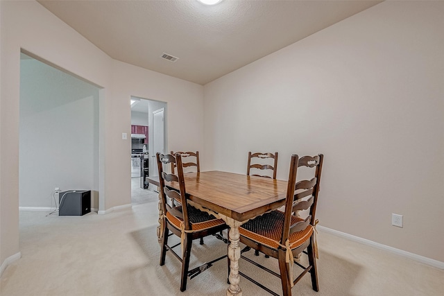 view of carpeted dining area