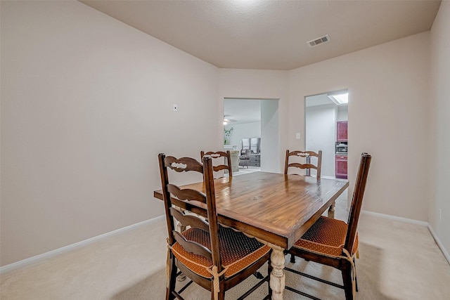 view of carpeted dining area