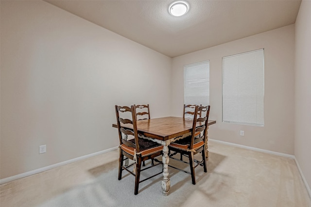 view of carpeted dining space