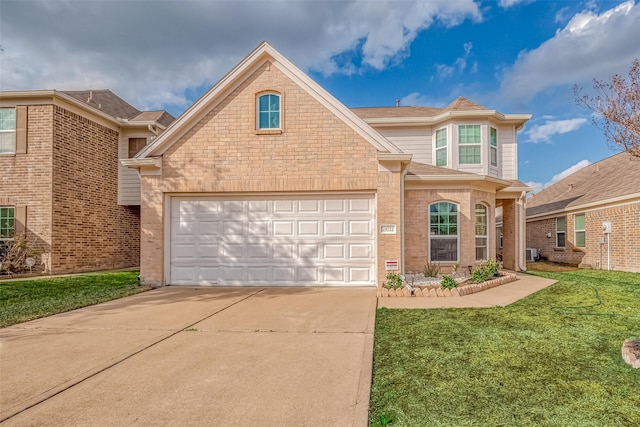 front of property featuring a garage and a front lawn