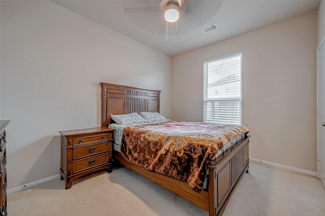 carpeted bedroom with ceiling fan