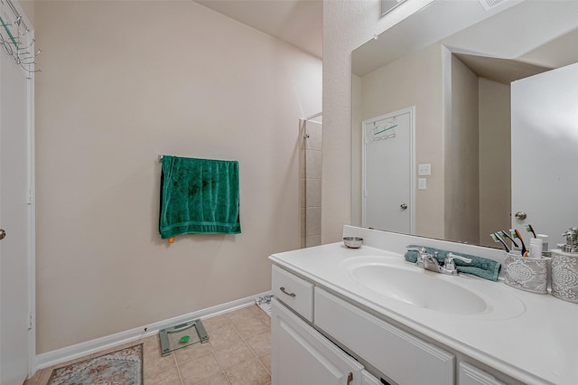 bathroom with tile patterned flooring and vanity