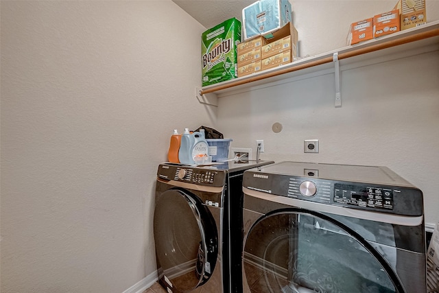 washroom with washer and clothes dryer