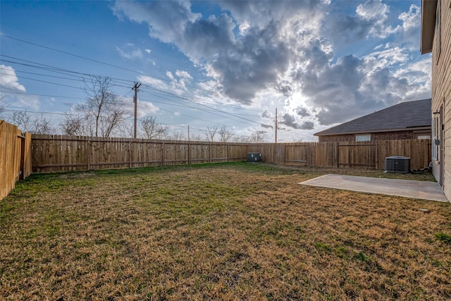 view of yard with a patio area and central air condition unit