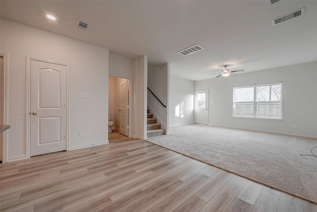 spare room featuring light hardwood / wood-style floors and ceiling fan