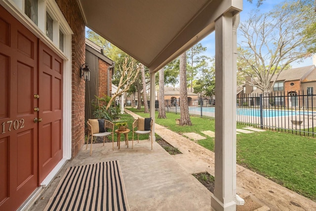 view of patio / terrace featuring a community pool