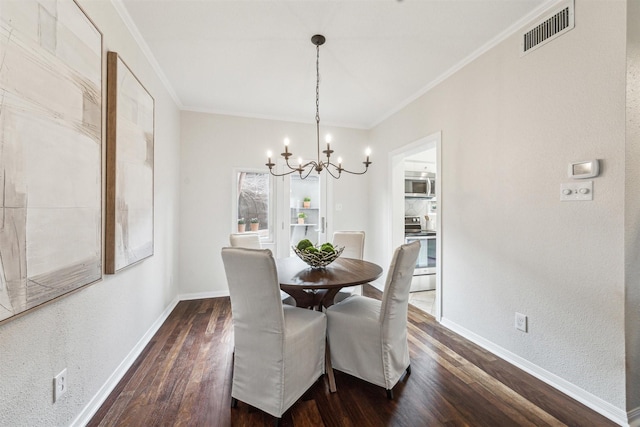 dining space featuring ornamental molding, dark hardwood / wood-style floors, and a chandelier