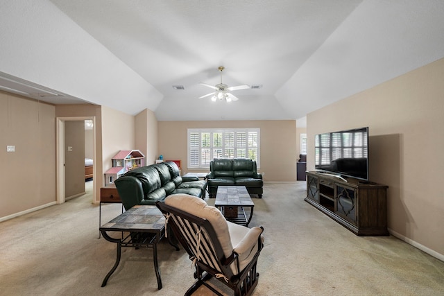 living room featuring vaulted ceiling, light colored carpet, and ceiling fan