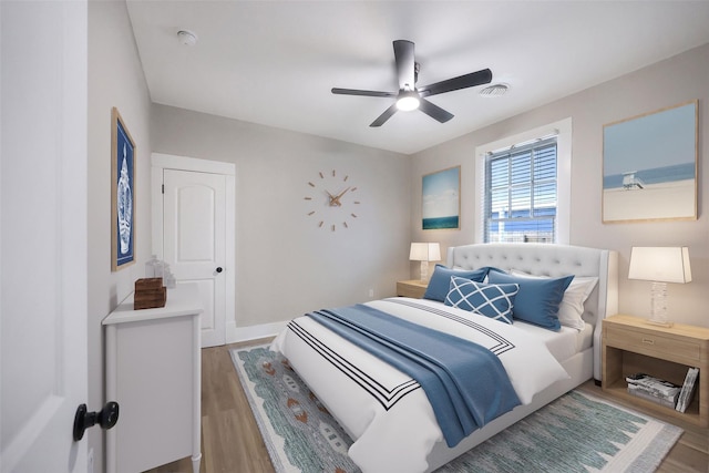 bedroom featuring hardwood / wood-style floors and ceiling fan