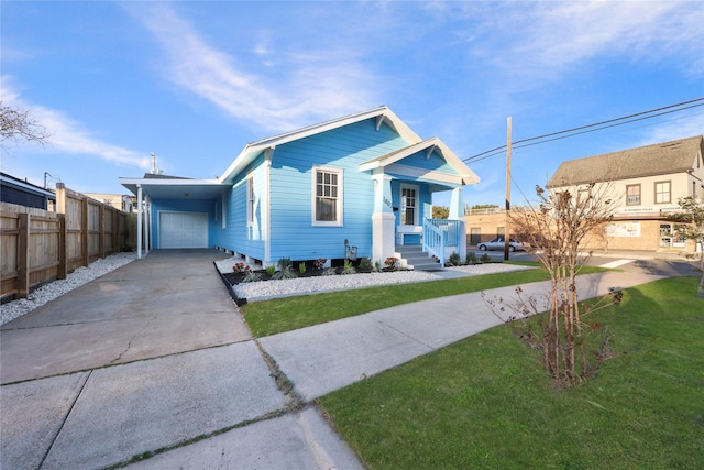 view of front of house with a carport and a front yard