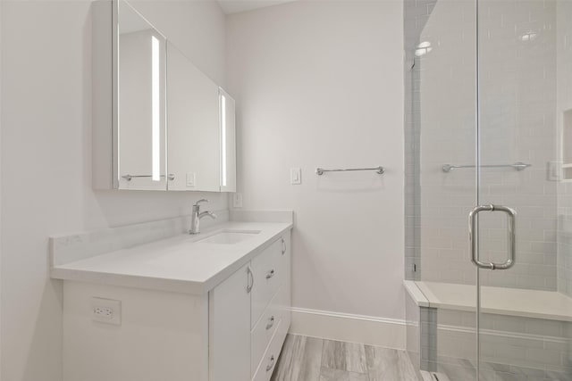 bathroom with vanity and walk in shower