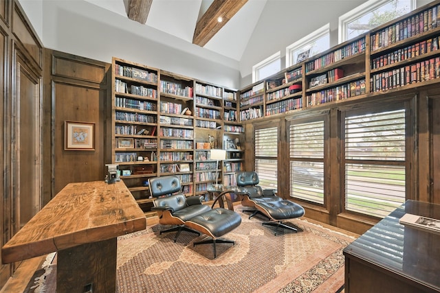 sitting room with high vaulted ceiling