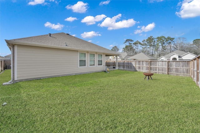 rear view of house with a lawn