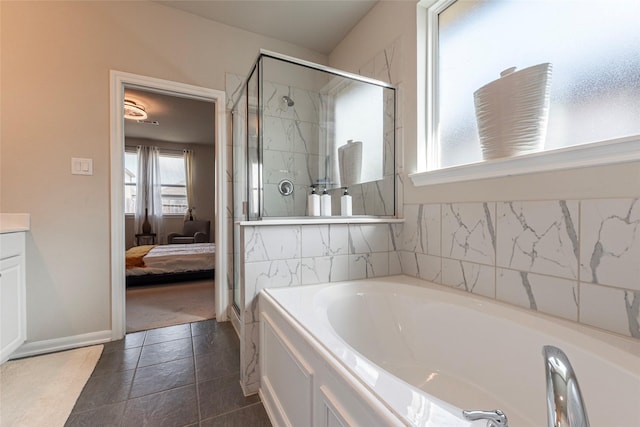 2230 Sand Lily Dr, Texas City, TX 77568 - ensuite bathroom featuring ensuite bathroom, a stall shower, and a garden tub