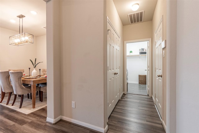 corridor featuring dark hardwood / wood-style flooring