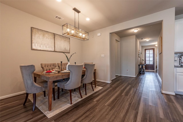 dining space featuring dark hardwood / wood-style floors