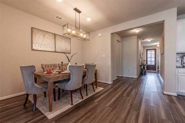 2230 Sand Lily Dr, Texas City, TX 77568 - dining room featuring visible vents, baseboards, dark wood-type flooring, and a notable chandelier
